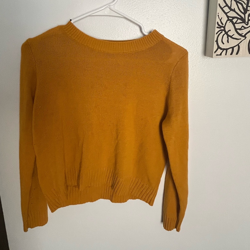 Divided yellow sweater. Size small. Never worn too small.